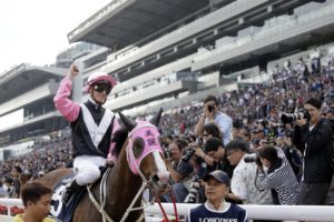 Beauty Only and jockey Zac Purton are greeted by the Sha Tin fans after winning the 2016 Hong Kong Mile (Hong Kong Jockey Club)
