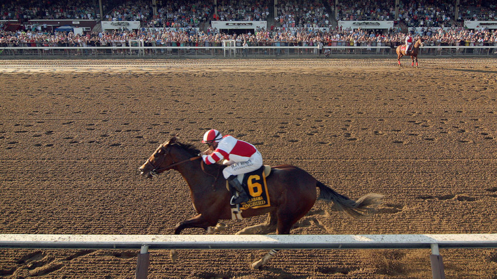 Songbird running in the Alabama Stakes with Fox Hill Farm silks. (Photo by Horsephotos.com)